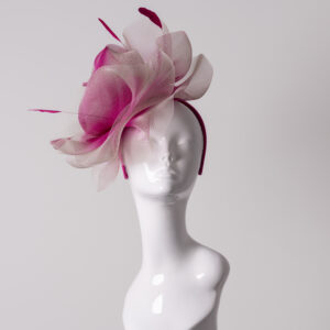 Pink and blush crin headpiece displayed on a white mannequin head